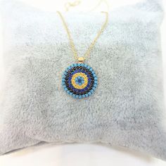 -The evil eye round design women jewelry pendant is made with high-quality 14K real solid gold. - We recommend you to review our other bracelets and necklaces. We have listed many kinds of beautiful and trendy gold and silver products. You won't regret! https://www.etsy.com/shop/LatikaJewelryShop - High polish finish and set with flawless cubic turquoise, black, yellow and navy blue zirconia stones. Its diameter is 1.5 cm. - This dainty, charm, elegant, cute, delicate and trendy women jewelry pe Gold Round Evil Eye Jewelry, Gold Evil Eye Round Jewelry, Yellow Gold Evil Eye Round Necklace, Gold Plated Evil Eye Round Pendant Jewelry, Round Evil Eye Jewelry Gift, Evil Eye Round Jewelry Gift, Yellow Gold Evil Eye Round Pendant Jewelry, Yellow Gold Evil Eye Round Pendant, Gold Plated Evil Eye Round Necklaces