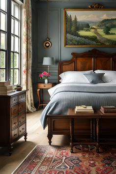 a bedroom with a large painting on the wall above the bed and an antique dresser