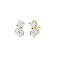 Dress up a simple outfit for a night out or for a semi-formal affair through these two-stone studs. These beauties come with a pair of diamonds on each earring - a square emerald diamond and an oval diamond mounted separately on individual prong baskets but sitting right beside each other. Their subtle edginess and stunning sparkle make them the perfect accessory to glam up any look. Elegant Formal Cluster Earrings With Prong Setting, Chic Oval Earrings For Formal Occasions, Classic Diamond Earrings For Party, Elegant Bridal Earrings With Brilliant Cut, Elegant Brilliant Cut Bridal Earrings, Modern Bridal Earrings For Wedding, Elegant Formal Cluster Earrings, Elegant Oval Cluster Earrings In Yellow Gold, Elegant Oval Cluster Earrings For Anniversary