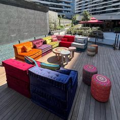 colorful couches and tables on a wooden deck