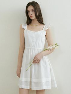 This is a trendy and casual dress by REORG that is made out of high quality and sturdy material. With distinctive mood of the design and comfortable wear, you can style it for your casual daily outfit.- Sleeveless tiered dress- Frill detail on the shoulder - Shirring detail on the waist Casual Tiered Dress With Ruffled Straps For Garden Party, Feminine Tiered Cotton Midi Dress, Spring White Sleeveless Dress With Ruffle Hem, White Sleeveless Dress With Ruffle Hem For Spring, White Sleeveless Tiered Dress For Summer, White Tiered Sleeveless Dress For Summer, White Tiered Sleeveless Summer Dress, Elegant White Tiered Dress With Ruffled Straps, White Sleeveless Dress With Ruffle Hem For Summer