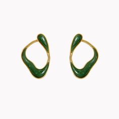 These stunning earrings feature nephrite jade framed by flowing 18K yellow gold. The 18K yellow gold setting is crafted with a subtle rope-like texture, creating a lovely contrast with the smooth, luminous stone. Part of the Fernando Jorge Stream Collection, these unique earrings loop from the front of the earlobe around to the back, evoking one continuous line of movement. Modern Yellow Gold Jade Jewelry, Luxury Jade Earrings In Elegant Style, Modern Green Earrings With Polished Finish, Luxury Fine Jewelry Made Of Jade, Unique Gold Jade Earrings, Luxury Green Jade Earrings, Nephrite Jade, Loop Earrings, Continuous Line