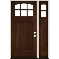 the front door is brown and has two sidelights