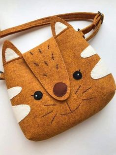 a small purse with a fox design on it