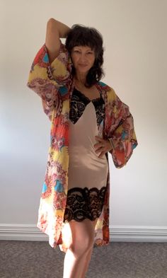 Gorgeous glam kimono jacket, designed with a sheer lightweight fabric, it flows as you move for a comfortable wear. It features a beautiful rich paisley print and vivid colour way and glimmer to brighten any day. It is finished with an open front and ¾ length sleeves, layer over your dress, top or bathers for easy opulence. Can be worn for all occasions from festivals to dinner party or light summer sun protection and during the cooler seasons by layering over jumpers and polo necks. Fabric is c Luxury Kimono, Pajama Robe, Womens Robes, Polo Neck, Light Summer, Kimono Jacket, Dress Top, Bridesmaids Gifts, Summer Sun