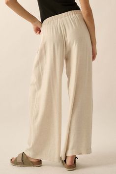 Solid linen-blend pants. Pleated front. Side-seam pockets. Waist button closure and zip-up fly. Wide leg. Elastic-back waist. Ankle length. Loose fit. 70% Rayon, 30% Linen. Imported. Designed in LA. Model wears size S. High-waist Linen Bottoms In Neutral Color, Versatile Beige Linen Wide Leg Pants, Chic Neutral Linen Bottoms, High Waist Linen Wide Leg Loungewear Pants, Chic Neutral Linen Pants, Chic Beige Linen Pants, Versatile Beige Pants, Versatile Beige Straight Pants, Versatile High Waist Beige Bottoms