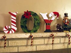 christmas decorations are displayed on the mantel