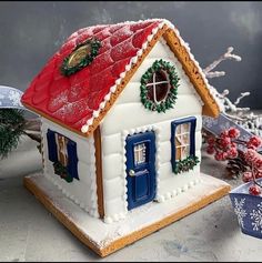 a gingerbread house decorated with christmas decorations