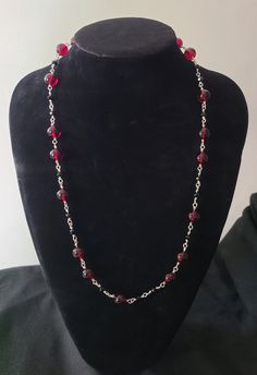 deep red and black elegant necklace. 10mm glass round beads alternating with black 6mm faceted beads with silver links. 26 inches long with a lobster clasp. Elegant Red Beaded Necklace With Lobster Clasp, Elegant Red Beaded Necklace With Black Beads, Elegant Red And Black Beaded Necklaces, Elegant Red And Black Beaded Necklace, Elegant Red Czech Glass Necklace, Faceted Bead Necklace, Black Bead Necklace, Elegant Necklaces, Deep Red