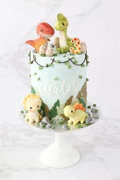 there is a cake that has animals on it