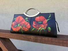 This black leather clutch with Red Poppies art is custom hand painted handbag. Expertly crafted with genuine black calfskin leather in a rigid structure. The handles combined with Silver-tone hardware. It includes a slim and detachable shoulder strap. The interior features a fabric lining with one zipper pocket and two divided compartments. ✿-----Item details: ON ORDER ONLY *The clutch made by order, I will make similar, but not the same because this is a handmade product. The photo is just a sa Elegant Hand Painted Rectangular Bag, Elegant Hand Painted Rectangular Bags, Artistic Rectangular Evening Bag, Poppies Art, Painted Handbag, Maximalist Art, Personalized Clutch, Yellow Purses, Handpainted Bags