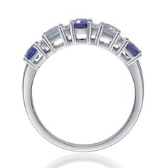 a white gold ring with blue sapphire stones