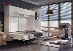 a bedroom with a bed and chair in it