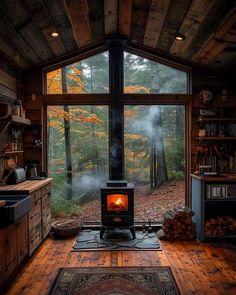 a wood burning stove sitting inside of a living room next to a large glass window