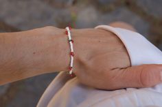 Look cute and summery with this seed bead bracelet/anklet! Perfect for you or as a gift! :)  MATERIALS - 2mm seed beads, elastic cord, silver coloured spring ring clasp LENGTH - Available in 4.5in, 5in, 5.5in, 6in, 6.5in, 7in, 7.5in, 8in, 8.5in and 9in! Please keep in mind every bracelet/anklet is handmade and unique so the size may vary slightly :) ADJUSTABILITY - Bracelet/anklet comes in 1 size only but I can add a chain extension to make it adjustable if needed! Simply message me to request t White Minimalist Friendship Bracelets For Summer, Minimalist Beaded Bracelets For Summer Beach, Minimalist Beaded Bracelets For Beach Summer, Minimalist Beaded Bracelets For Beach In Summer, White Minimalist Beaded Bracelets For Summer, Minimalist White Beaded Bracelets For Summer, Minimalist Beaded Bracelets With Tiny Beads For Summer, Minimalist Beaded Bracelets For Everyday Summer Wear, Minimalist Beaded Bracelets For Summer