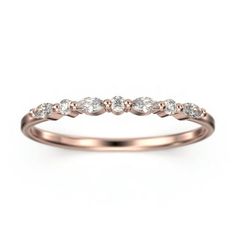 a rose gold wedding ring with five diamonds on the top and bottom, set in 18k