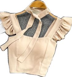 Trendy Beige Vest Crop Top, Fitted Sleeveless Beige Crop Top, Beige Fitted Sleeveless Crop Top, Beige Stretch Vest Crop Top, Beige Stretch Vest Top, Beige Stretch Top For Party, Trendy Beige Party Top, Trendy Beige Tops For Party, Beige Vest Crop Top For Spring