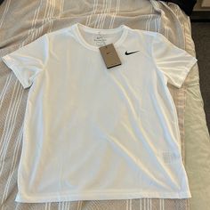 Nike White Dri-Fit Women’s Top Size Medium Nwt 100% Polyester, No Stretch Tops Nike, Nike Shirt, Dri Fit Shirt, Nike Tshirt, Nike Sports, Nike White, Athletic Shirts, Sports Top, Nike Shirts