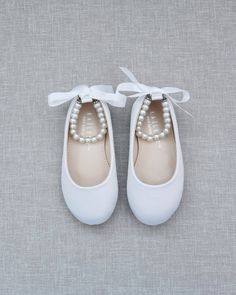 Satin flats with gorgeous row of pearls and gold beads rhinestones ankle strap for a girl who is looking for comfort and simple chic style. Perfect for flower girls, pair up with tutu ballerinas, fairies or birthday parties. DETAILS: COLORS AVAILABLE: White, Off White, Blush Pink, Champagne and BurgundyUPPER: Synthetic upper and liningMATERIALS: Manmade outsoleORIGIN: ImportedSTYLE NAME: HARPER-57 Flower Girls Shoes, Communion Shoes, White Shoes For Girls, Flower Girl Shoes, Kids Flats, Party Inspo, Pointy Toe Flats, Princess Shoes, Purple Shoes