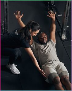 a man and woman doing exercises in the gym