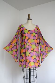 "INCREDIBLE 1960s go-go dress! This dress features a fun chiffon dotted dress with absolutely over-the-top sleeves The drape low but also have openings at the sides. See the video on instagram on how the sleeves move when worn!!  Label: Wm.G Measurements: { xsmall } Bust: 33\"  Waist: 33\" Hips: 35\" Length: 31\" Sleeve Length: 22.5\" Condition: nearly excellent vintage condition with some pinholes throughout as shown. minor signs of wear - sold as found ☆Shop☆ http://www.trunkofdresses.com/" 1960s Glam, 1950s Shirtwaist Dress, Go Go Dress, 60s Mod Fashion, Gogo Dress, 60s Look, Dotted Dress, 70s Outfits, Shirtwaist Dress