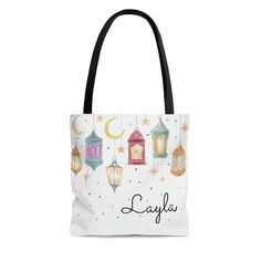 a white tote bag with lanterns and stars on it