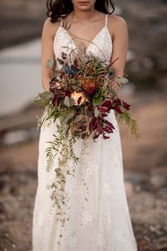 a woman in a white dress holding a bouquet