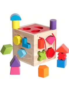 a wooden block toy with different shapes and colors