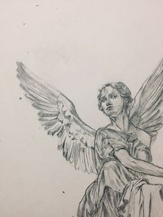 a drawing of an angel sitting on top of a table