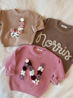 Hi and welcome to my shop!  As a new mom of a little one, I began embroidering sweaters for mom friends, and would love to extend the love even further. These personalized oversized knit name sweaters are the perfect gift for any baby or toddler! Customized baby name sweaters make great baby shower gifts and birthday gifts and are wonderful to take monthly milestone photos of your baby in to watch them grow. They can also be used as a baby announcement, Christmas gifts, valentines or easter gift Baby Name Sweater, Knit Embroidery Sweater Name, Embroidered Name Sweater, Birthday Baby Announcement, Baby Sweater With Name, Embroidered Baby Name Sweater, Baby Keepsakes, Pull Bebe, Pull Oversize