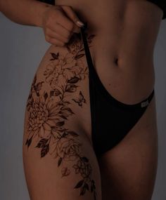 a woman's stomach with flowers on it