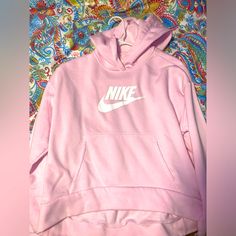 Never Worn Yl (Xs Woman Fits Too) Pink Nike Hoodie. It Is Cropped Slightly In The Front. Smoke Free Home Bought From Nike.Com. Nike Crew Neck Hoodie For Spring, Nike Spring Hoodie For Loungewear, Nike Spring Loungewear Hoodie, Nike Hooded Top For Loungewear, Spring Nike Hoodie For Loungewear, Nike Hooded Top With Letter Print, Nike Hoodie For Spring, Nike Pink Winter Tops, Nike Cotton Hoodie With Letter Print