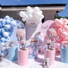 baby shower decorations and balloons are on display at a party in the shape of elephants