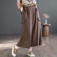 Details: Gender: Women Item Type: Skirts Material: Linen Season: Summer Pattern: Solid Style: Casual, Loose, Retro Waist Type: Elastic Waist Size: One Size Waist: 70.00 - 102.00 cm/ 27.56 - 40.16 " Length: 82.00 cm/ 32.28 " Hip: 108.00 cm/ 42.52 " Casual Non-stretch Skirt With Pockets, Relaxed Fit Skirted Bottoms With Pockets, Spring High Waist Solid Cargo Skirt, Casual Maxi Skirt For Spring Workwear, Casual Long Skirt With Side Pockets, Relaxed Fit Midi Skirt With Pockets, Spring Full-length Skirt With Side Pockets, Casual Baggy Midi Skirt, Spring Full Length Skirt With Side Pockets