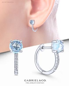 14K White Gold 10mm Sky Blue Topaz and Diamond Huggie Earrings. EG13574W45LB #GabrielNY #DiamondJewelry #FineJewelry #Gabriel&Co #UniqueJewelry #FineJewelry#FashionJewelry #GiftIdeas#UniqueGifts  #Earrings #FashionEarrings #WhiteGoldEarrings #WhiteGoldFashionEarrings #GoldEarrings #GoldFashionEarrings Elegant Gemstone Huggie Earrings For Formal Events, Elegant Gemstone Huggie Earrings For Formal Occasions, Elegant Formal Huggie Earrings With Gemstone, Formal Fine Jewelry Huggie Earrings With Gemstones, Luxury Round Sterling Silver Huggie Earrings, Sterling Silver Gemstone Huggie Earrings, Luxury Sterling Silver Huggie Earrings, Luxury Lever Back Earrings For Anniversary, Elegant Gemstone Huggie Earrings As Gift