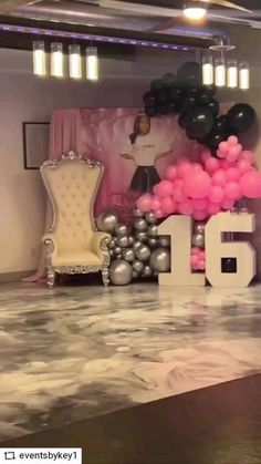 the table is decorated with balloons and numbers