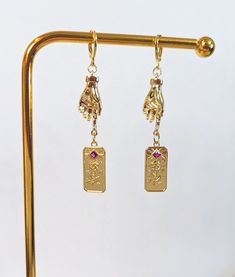 Gold plated Earrings with cubic zirconia gemstones. Hypoallergenic.  The actual product color(s) may vary slightly from the images shown in my listing photos. Every monitor or mobile display has a different capability to display colors, and every individual may view these colors differently. Also, lighting conditions during the photo can affect an image's color. I cannot guarantee that the color you see accurately portrays the product's true color.   We always recommend storing our pieces out of Gold Plated Pierced Crystal Earrings As A Gift, Gold Jeweled Fine Jewelry Earrings, Gold Spiritual Crystal Earrings As A Gift, Gold Spiritual Crystal Earrings For Gift, Gold Crystal Earrings For Spiritual Gift, Gold-plated Jeweled Earrings For Gift, Gold Plated Jeweled Earrings Gift, Jeweled Dangle Jewelry Gift, Gift Crystal Dangle Earrings With Plating