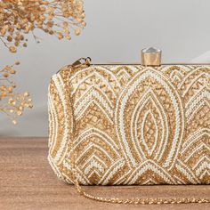 Golden Bead Pearl Hand Embroidered Clutch Bridal Bridesmaid Gift In | Elegant Wedding Handbag | Bead Embellished Wristlet Clasp Clutch Purse Take your look to the bold attitude with this embellished clutch. Defined by beautiful Zardosi. Make it the ideal addition to any stand-out style. Height : 4.5inch Width : 8inch Depth : 2inch Handmade Clutch. Suitable for every special occasion. Add grace to your dressings. Perfect For Weddings, Parties Etc. These bags can be also used for gift purpose . We Party Clutch With Pearl Embroidery In Gold, Party Gold Clutch With Pearl Embroidery, Gold Clutch With Pearl Embroidery For Party, Elegant Sequined Evening Bag For Gifts, Elegant Sequined Evening Bag As Gift, Festive Beaded Clutch Evening Bag, Gold Beaded Clutch For Wedding, Gold Hand-embellished Evening Bag For Wedding, Festive Gold Beaded Evening Bag