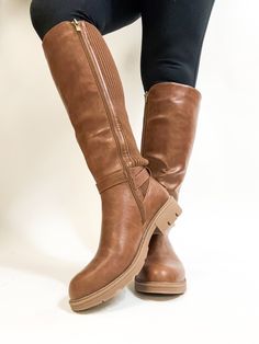 Our popular Wide Calf Boots are back!!! These are your perfect everyday essential boot for fall! These have a faux leather look with that cross over buckle detail. There is a zipper to give you easy access to slip these on. But the best part is the STRETCH these boots have in the calves. These boots are 18 inches tall and will fit up to an 22 inch calf. True to size. Half sizes, size up in these boots. Made of Vegan leather in the front, back is a stretchy ribbed fabric Corkys Boots Wide Calf, Boots Wide, Wide Calf Boots, Wide Calf, Wide Boots, Calf Boots, Ribbed Fabric, Easy Access, Everyday Essentials Products