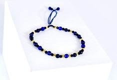 ∙Description and details: ∙Our Pure Blue Bley bracelet is a Lapis Lazuli and Rock Crystal stone bracelet, is totally handmade, combining stone balls with rock crystal with a fine and subtle touch. Also with a waxed cord so that nothing can against it and with a double knot to be able to adjust to the size you want with great ease, As piece with a high quality finish. This bracelet is commonly known to be a stone lucky bracelet. *Made in London* ∙Name: Pure Blue BLEY bracelet. ∙ Material: Lapis lazuli and rock crystal. ∙ Colour: Blue and Yellow. ∙UNISEX. ∙Size: ∙Adjustable. ∙Thickness: 4mm ∙ All orders include a high-quality bag made of leather for our brand's jewelry, as you can see in the last packaging photo. ∙ ∙In Bilik Bley we work with Hight quality and top rated products for all cust Adjustable Hand-strung Lapis Lazuli Bracelets, Adjustable Lapis Lazuli Bracelet With Round Beads, Adjustable Lapis Lazuli Beaded Bracelets, Gift Lapis Lazuli Round Bead Bracelets, Gift Lapis Lazuli Bracelets With Round Beads, Lapis Lazuli Bead Bracelet Gift, Adjustable Lapis Lazuli Bracelet With 8mm Beads, Adjustable Elegant Lapis Lazuli Bracelets, Adjustable Lapis Lazuli Gemstone Beaded Bracelets