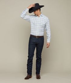 Named for our El Paso factory, this rugged, cotton western shirt features a cowboy yoke in front and back with a subtle, embroidered mirrored-L emblem on the left pocket and lower placket. Classic cowboy fit. Model is 6'2 and wearing size M. Western Shirt With Pockets For Ranch, Classic Shirt With Pockets For Rodeo, Country Style Cotton Shirt For Rodeo, Classic Blue Tops For Rodeo, Fitted Cotton Shirt For Country Events, Fitted Tops With Pockets For Rodeo, Western Cotton Shirt For Country Events, Fitted Western Tops With Pockets, Western Style Fitted Tops With Pockets