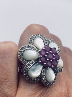 Vintage Pink Ruby Mother of Pearl White Sapphire 925 Sterling Silver Flower Ring https://www.etsy.com/listing/1306444593/vintage-pink-ruby-mother-of-pearl-white?utm_source=crowdfire&utm_medium=api&utm_campaign=api Elegant Multi-stone Flower Ring, Flower Shaped Ring With Accent Stones For Anniversary, Elegant Flower-shaped Multi-stone Rings, Fine Jewelry White Flower Ring With Gemstone, Silver Multi-stone Flower Ring For Anniversary, White Sterling Silver Cluster Ring Hallmarked, Multi-stone Flower Ring Fine Jewelry, Sterling Silver Flower Shaped Gemstone Ring, Fine Jewelry Multi-stone Flower Ring