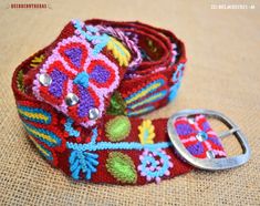 WOOL EMBROIDERY BELT "BLOSSOM MAGICAL" - PERUVIAN HANDICRAFTS - GIFTS FOR WOMEN Blossom Magicasl, Flowers blossom in a great palette of cherry color, red, blue, yellow, lead, green (different shades) and fuchsia. Our team of craftsmen of Ayacucho-Peru designed this stunning Black wool belt that is woven on a traditional loom. The buckle is made from a mix of zinc, aluminum, magnesium and copper is sealed with a rust-proof silver patina (Buckle belt may vary from one to another). Belt 100% handmade!! - Each piece is unique   ►ITEM DETAILS. ----------------------------------------------------------------------------------------------- *ID:BELM301521-M *Sizes:  M: 40" Long / fits 28" - 35" (124 CM Long / fits 71cm -89cm) *Technique: Belt made based on backstrap loom and hand embroidery *Mater Colorful Belt, Embroidery Belt, Cherry Color, Backstrap Loom, Women Waist, Wool Embroidery, Belt Women, Embroidery Materials, Women Gifts