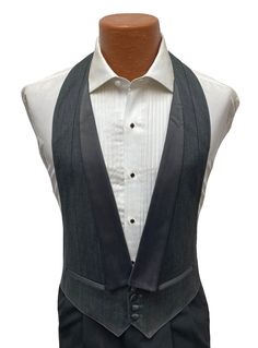 Men's Grey Tuxedo Vest  This is a handsome grey open-back vest from our rental stock.  It features a four button front and satin lapels.  High quality made in the USA.  Vest will adjust with the band around neck and just above the waist in back.   Listing is for the vest only.  If you are interested in a cutaway(morning coat) or are in need of additional formal wear please visit my eBay store. Formal Tuxedo Style Sleeveless Vest, Luxury Formal Tuxedo Vest, Elegant Single-breasted Vest With Notch Lapel, Semi-formal Single-breasted Vest With Notch Lapel, Luxury Semi-formal Tuxedo Vest, Grey Tuxedo, Types Of Suits, Morning Coat, Tuxedo Vest