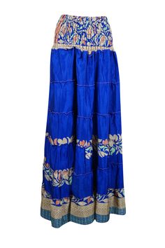 Embrace your free-spirited side with our Navy Blue Floral Boho Chic 2 in 1, Maxi Skirt Dress designed for the modern soul who loves to blend comfort and style. This flowing, maxi-length skirt features floral prints and earthy tones, perfect for creating a laid-back yet hippie-style look. Handcrafted with care, the skirt boasts tiered layers, ruched waist that can be pulled up as a strapless dress and subtle, giving it a graceful, gypsy flair. Whether you're strolling on the beach or attending a Blue Bohemian Maxi Dress With Tiered Skirt, Bohemian Flowy Full-length Maxi Skirt, Blue Tiered Maxi Dress For Vacation, Blue Flowy Tiered Maxi Skirt, Beach Ankle-length Maxi Skirt, Flowy Ankle-length Skirt For Vacation, Blue Bohemian Long Dress, Ankle-length Maxi Skirt For Vacation, Hippie Flowy Maxi Dress