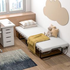 two twin beds in a small room with a desk and chair