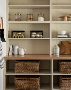 the shelves are filled with various items and baskets