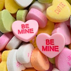 conversation hearts with be mine written on them