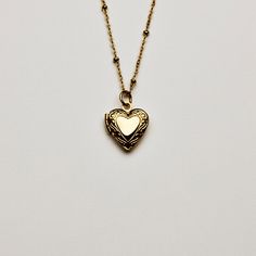 Whether it be a photo of a loved one, your cat or Harry Styles. Keep it close to your heart with our locket. Also available in Silver 16” + Extension Small: 1.29 cm X 1.33 cm Large: 1.97 cm X 1.91 cm Stainless Steel & Gold Plated Tarnish & Water Resistant Hypoallergenic Heart-shaped Locket Necklace For Keepsakes, Nickel-free Heart Locket Necklace For Memorial, Heart-shaped Nickel-free Locket Necklace For Memorial, Memorial Heart-shaped Nickel-free Locket Necklace, Dainty Heart Locket Necklace For Keepsake, Heart Shaped Locket Necklace With Heart Charm For Memorial, Heart-shaped Locket Necklace With Heart Charm For Memorials, Heart Charm Memorial Locket Necklace, Memorial Heart Charm Locket Necklace