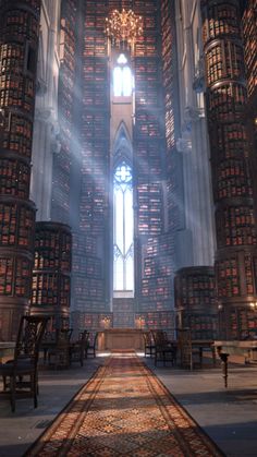 a large room filled with lots of books on top of a floor next to a tall window